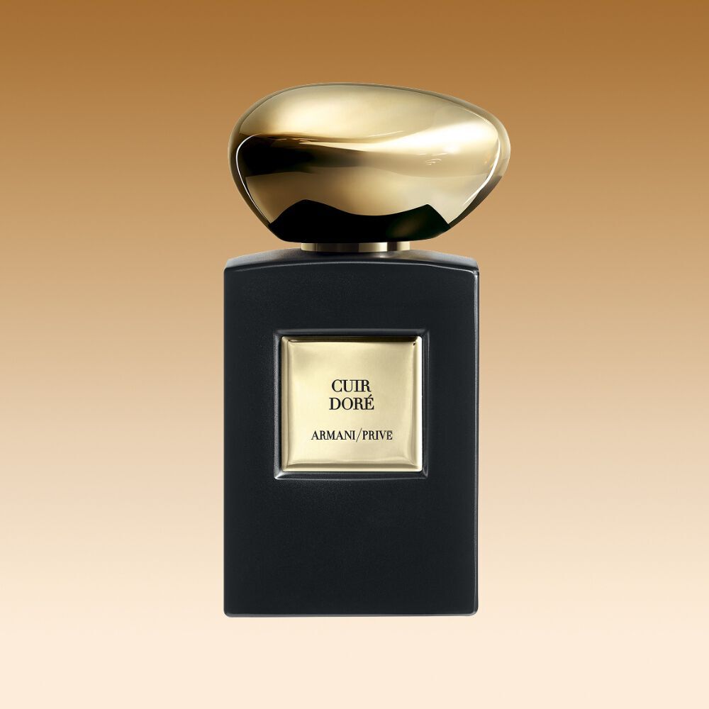 Armani/Prive Cuir Dore fragrance bottle with matte black finish and precious golden cap.