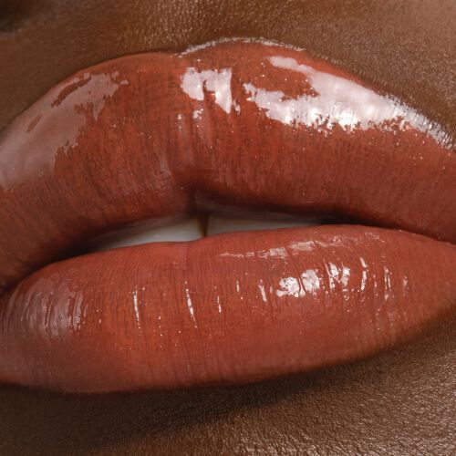 Armani Prisma Flash 12 Maple Flash lipstick on lips, showing a deep maple brown with a glossy finish.