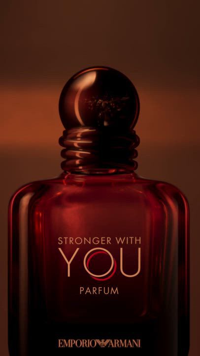 Emporio Armani 'Stronger With You' perfume ad. Features the distinctive bottle, dynamic party scenes, and intimate connections. Highlights the fragrance's allure as a man applies it, showcasing confidence. Concludes with 'Stronger With You Parfum' and 'Amber' bottles, embodying the magnetic Emporio Armani essence.