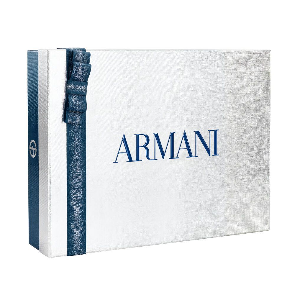 Giorgio Armani Acqua di Gio — white and silver Armani gift box tied with a blue satin ribbon, holiday gifting presentation on a clean white surface.