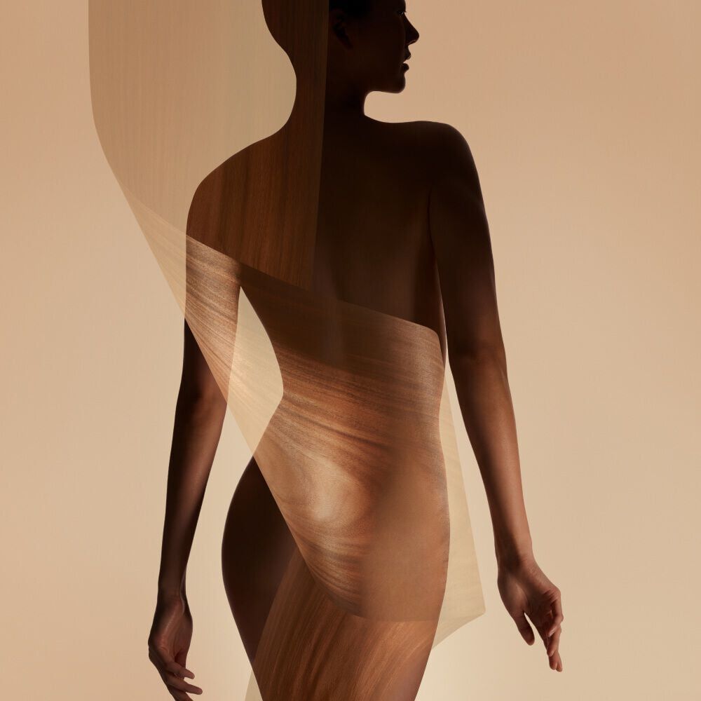Armani/Prive Santal Dān Shā: elegant female silhouette with layered textures, embodying the fragrance’s refined sensuality and contemporary luxury.